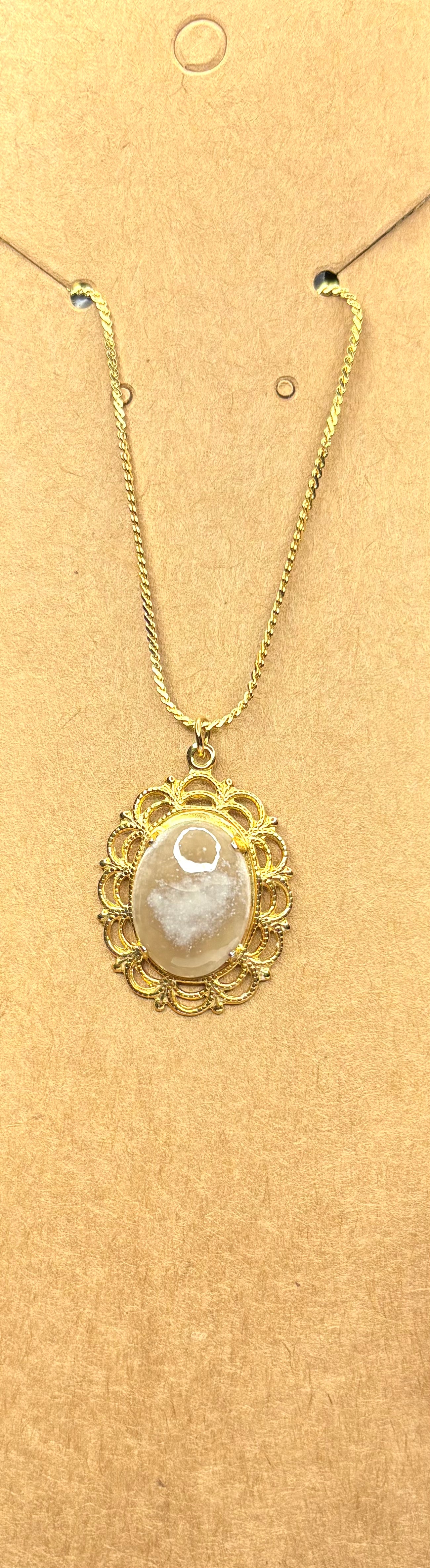 Clear opal pendant on gold setting