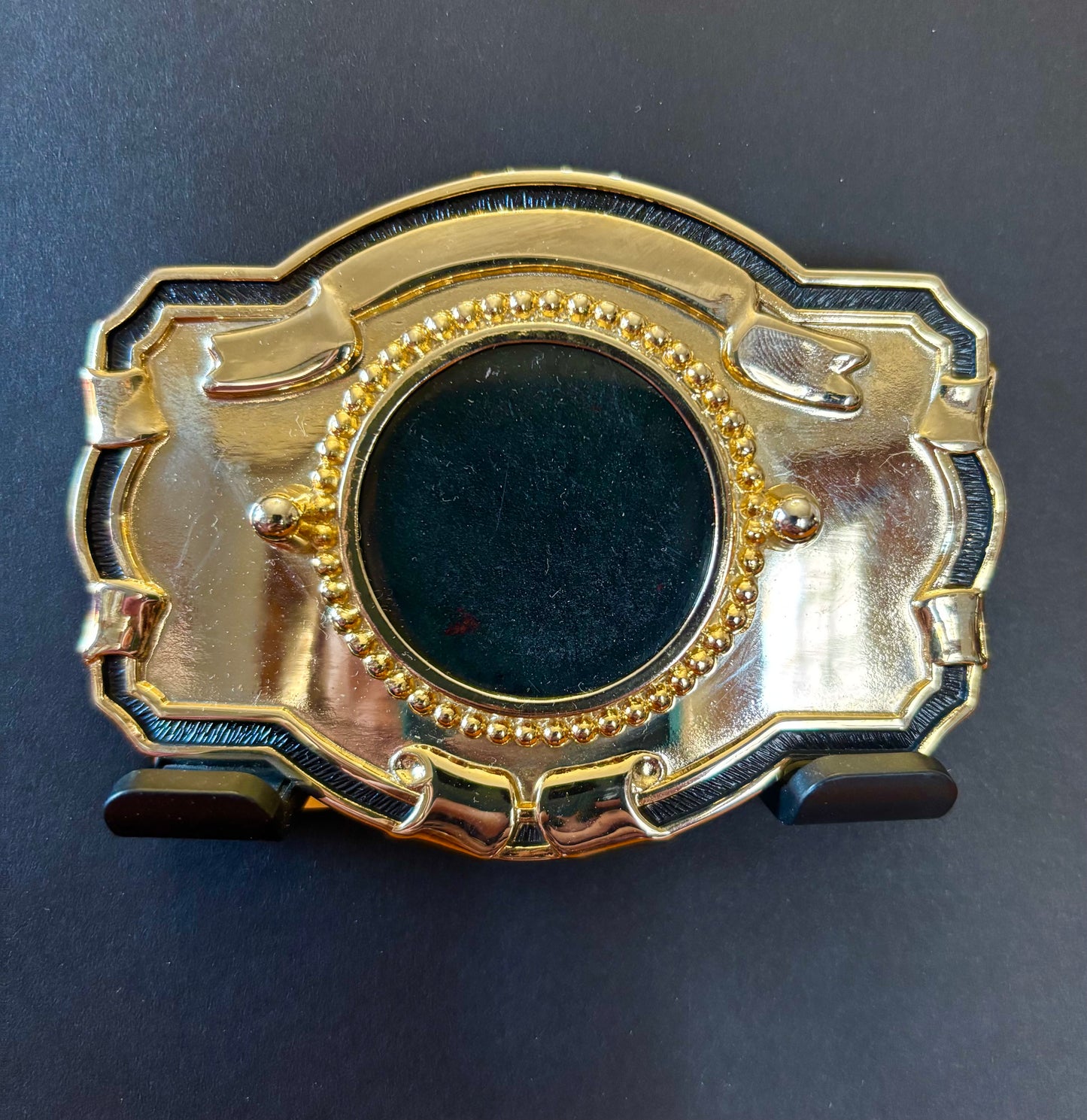 Gold and black lined belt buckle with black jade inlay