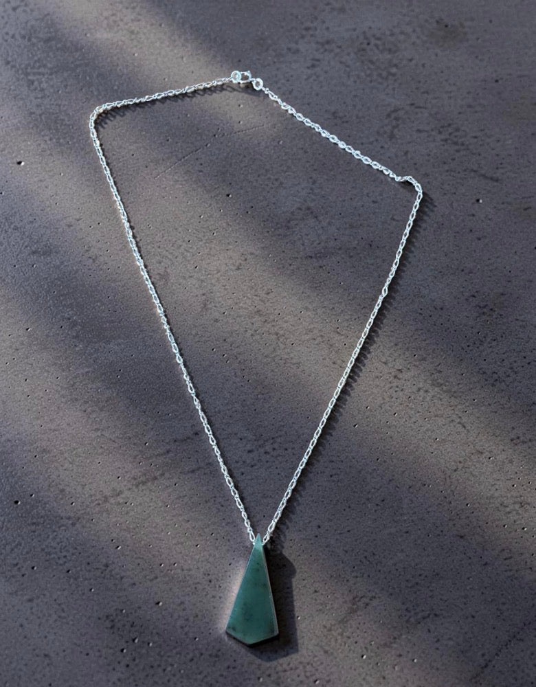 Beautiful green triangle necklace.
